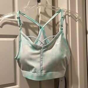 Mint green and white Nike sports bra with adjustable straps